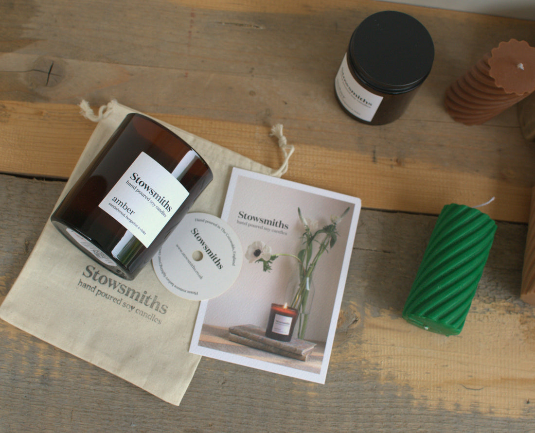 flat lay of candle with cotton gift bag